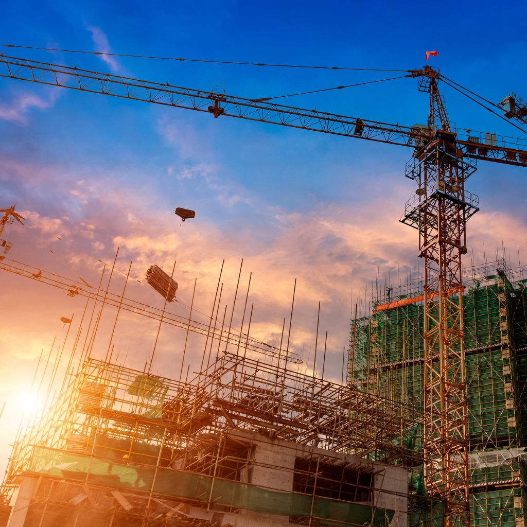 Workers building tower shelter concrete foundation